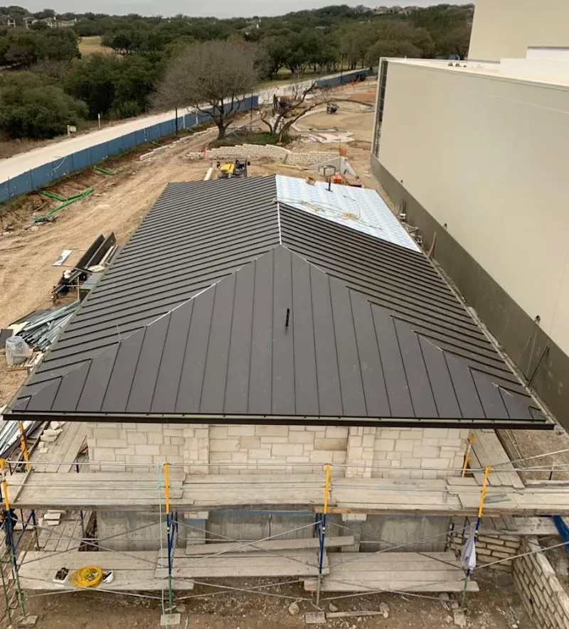 Metal roof new construction with scaffolding in Kingston